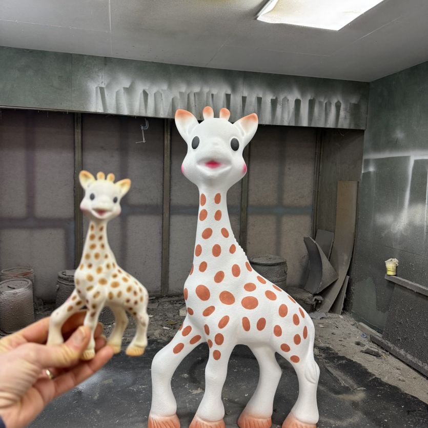 Scaled up toy giraffe comparison 
