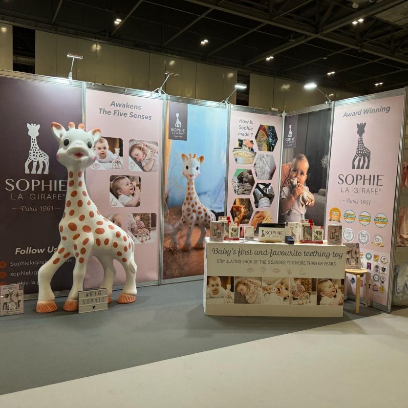 Large toy giraffe at an exhibition 