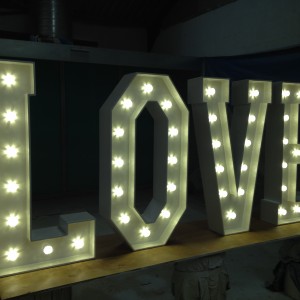 Light up letters spelling LOVE in the making