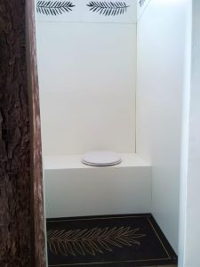 Unique compost toilet inside a tree